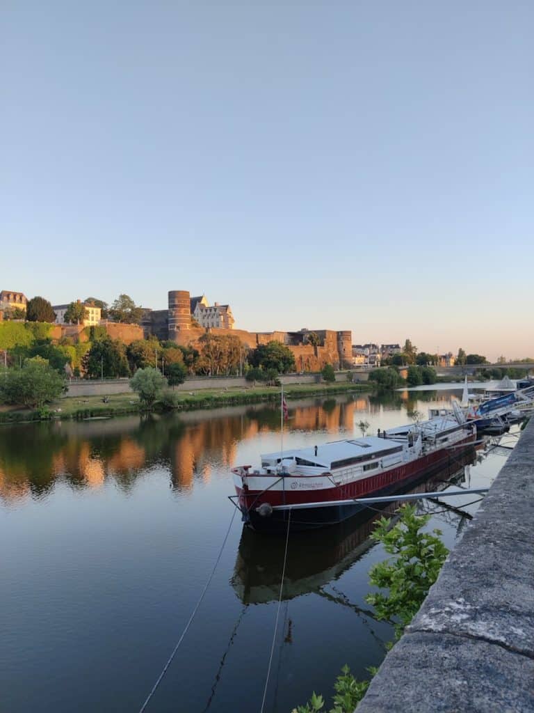 a row of boats sitting on top of a river