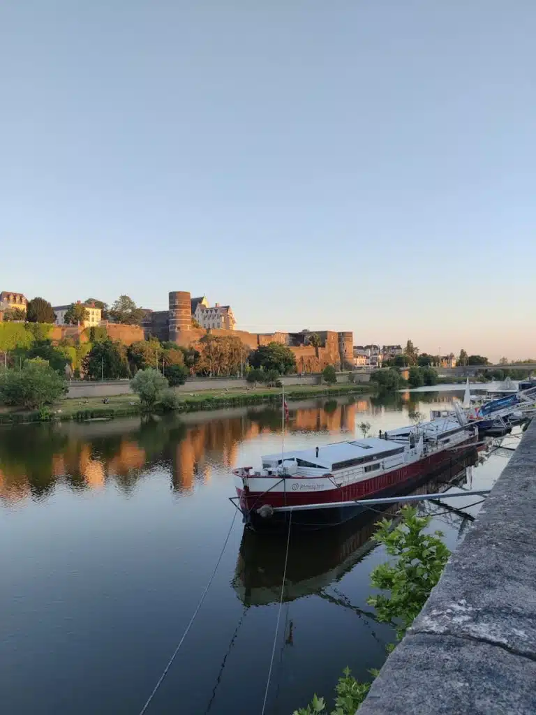 a row of boats sitting on top of a river
